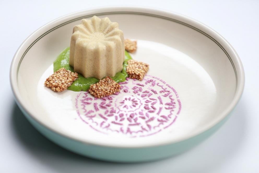 PHOTO: A mixed nuts panna cotta pudding with pistachio mousse, hibiscus powder and sesame brittle.