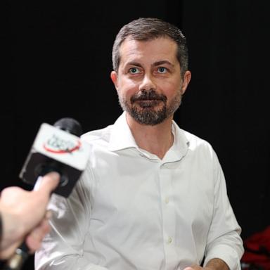 PHOTO: Former Transportation Secretary and 2020 presidential candidate Pete Buttigieg speaks the press backstage after a rally at The Mother Lode Theatre, May 17, 2026, in Butte, Montana. 