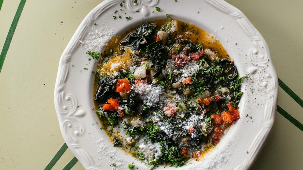 PHOTO: A bowl of cannellini bean and kale soup with lots of shallots.