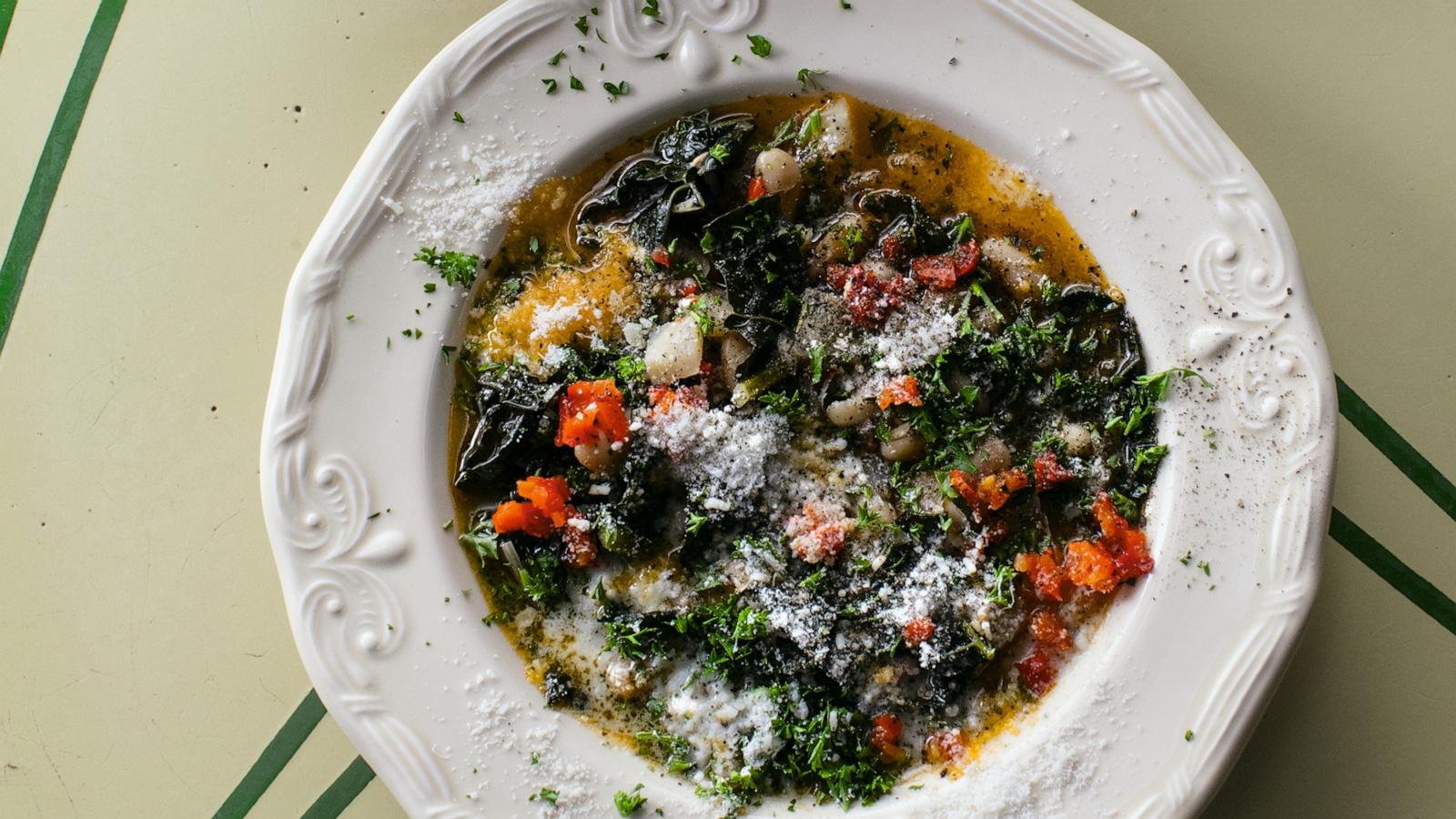 PHOTO: A bowl of cannellini bean and kale soup with lots of shallots.