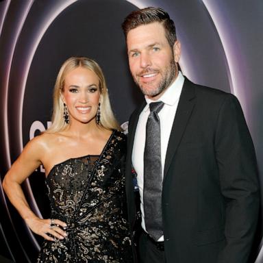 PHOTO: Carrie Underwood and Mike Fisher attend Opry 100: A Live Celebration at Grand Ole Opry, Mar. 19, 2025 in Nashville, Tennessee. 