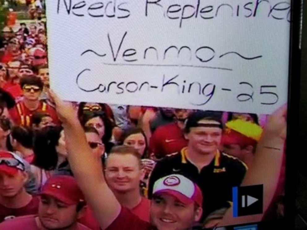 PHOTO: Carson King waved a sign that read Busch Light Supply Needs Replenished during ESPNs College GameDay.