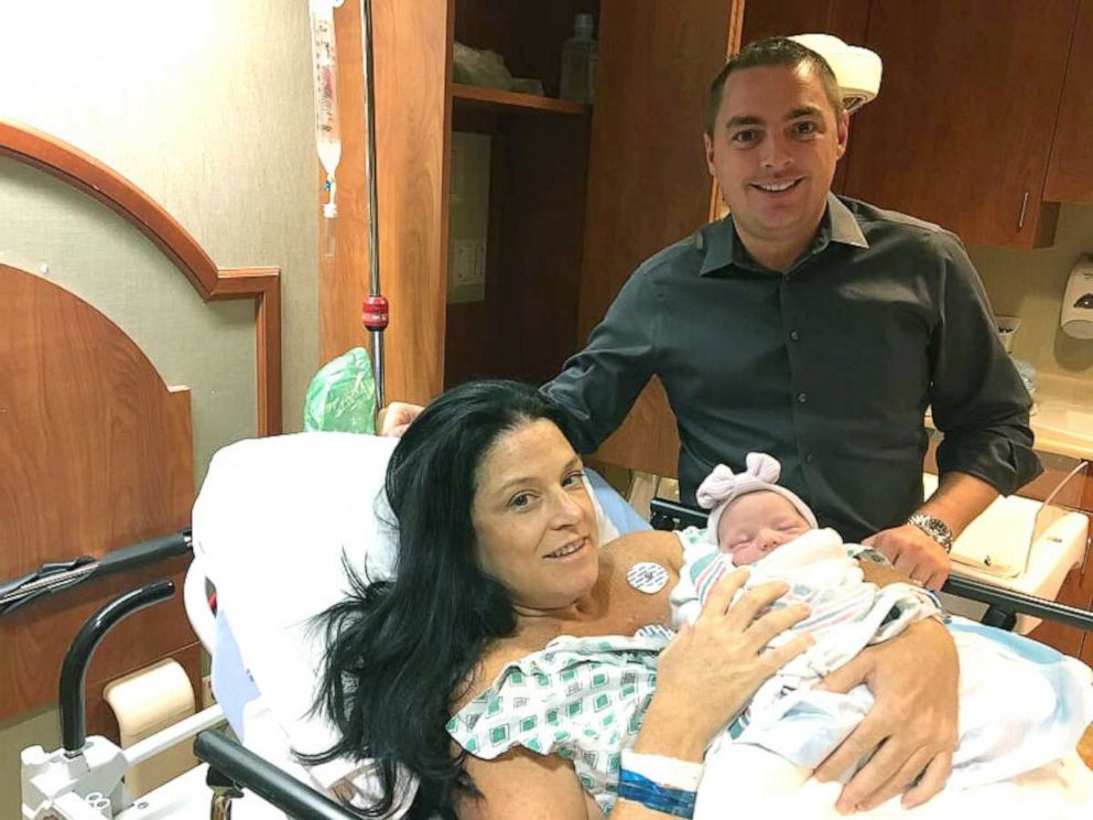 PHOTO: Erin and Michael Martucci pose with their daughter Catherine.