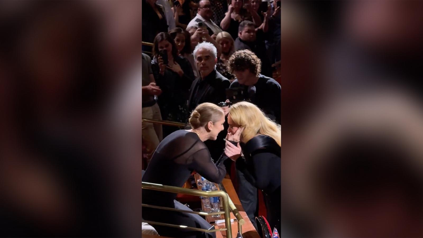 PHOTO: Celine Dion and Adele embrace during Adele's concert in Las Vegas.