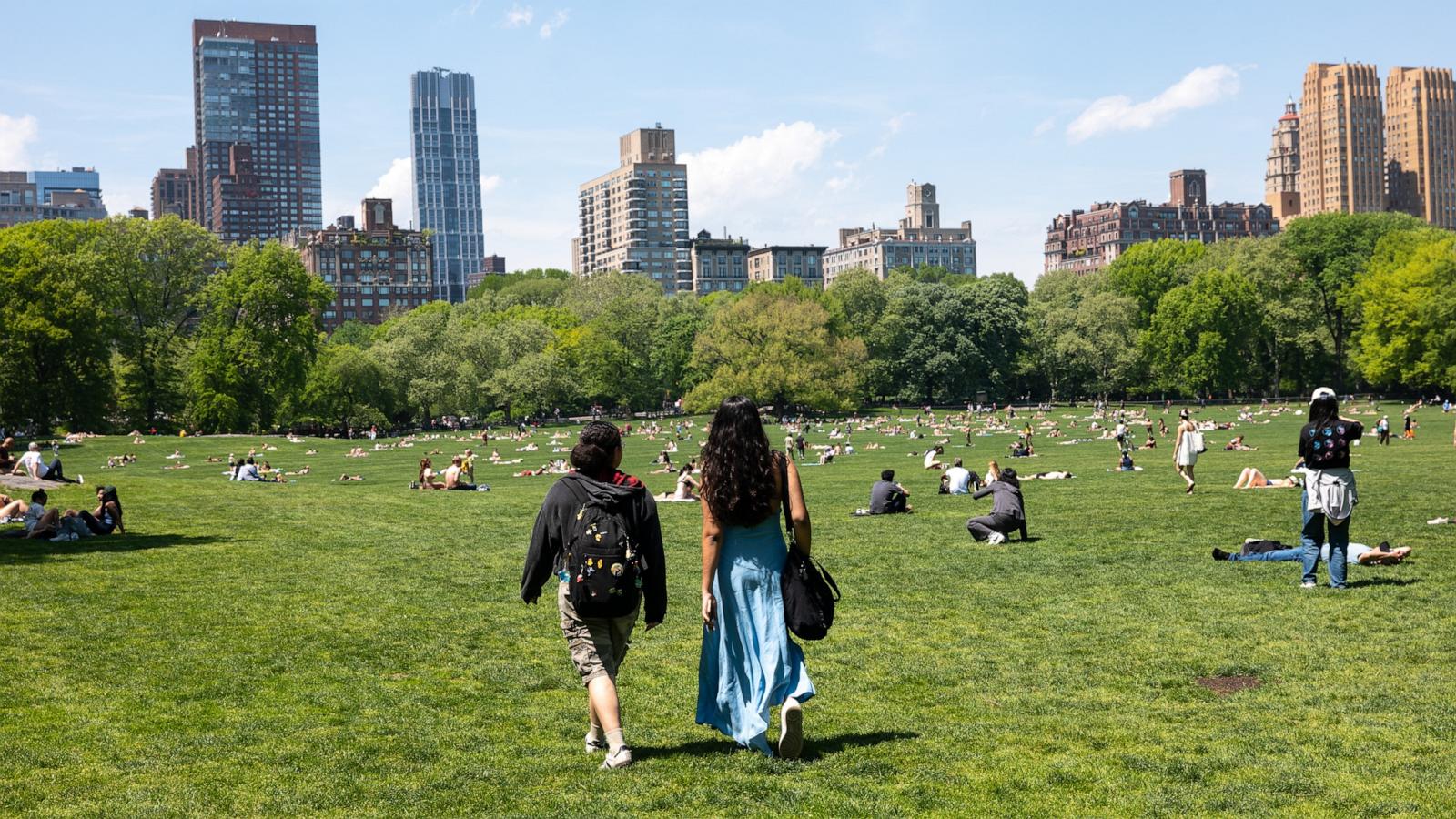 People gather on a lawn at Central Park on an unseasonably warm spring day in Manhattan on May 05, 2026, in New York City.