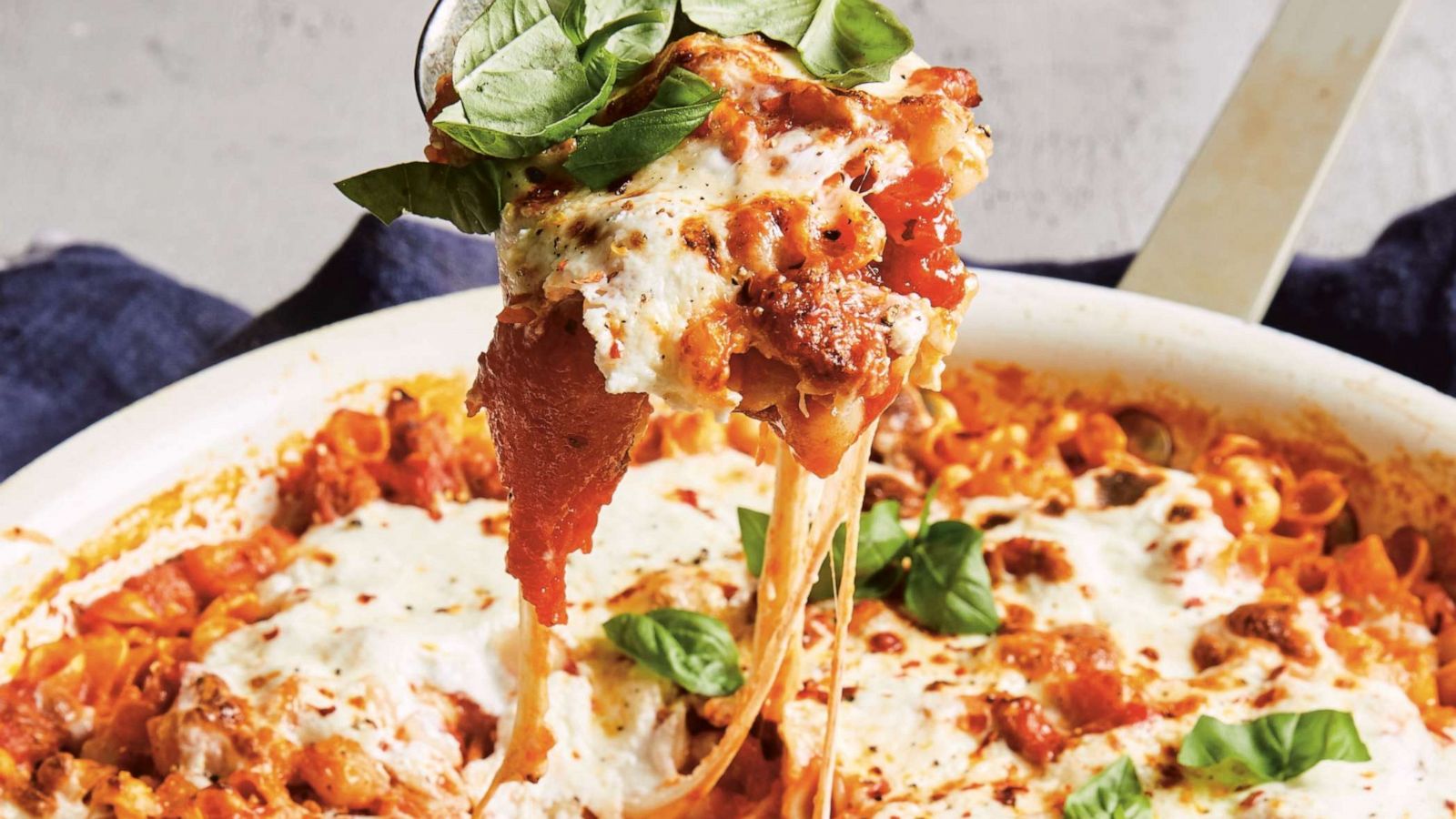 PHOTO: Cheesy baked pasta with tomato, sausage and ricotta.