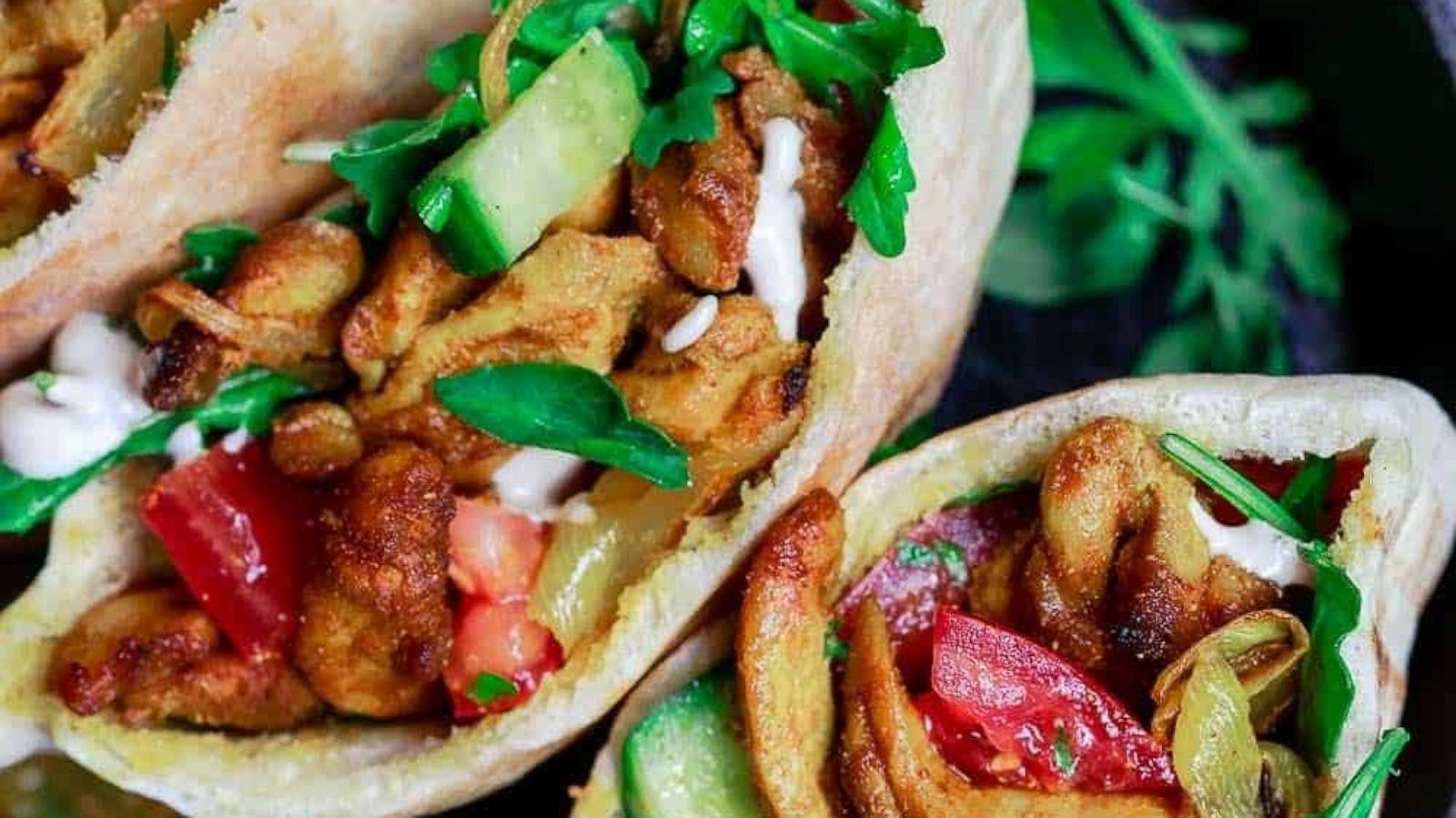 PHOTO: A plate of homemade chicken shawarma pitas with vegetables.