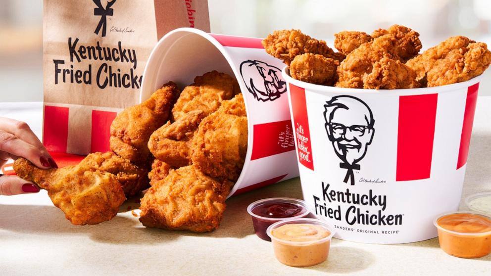 PHOTO: KFC chicken tenders and traditional fried chicken buckets.