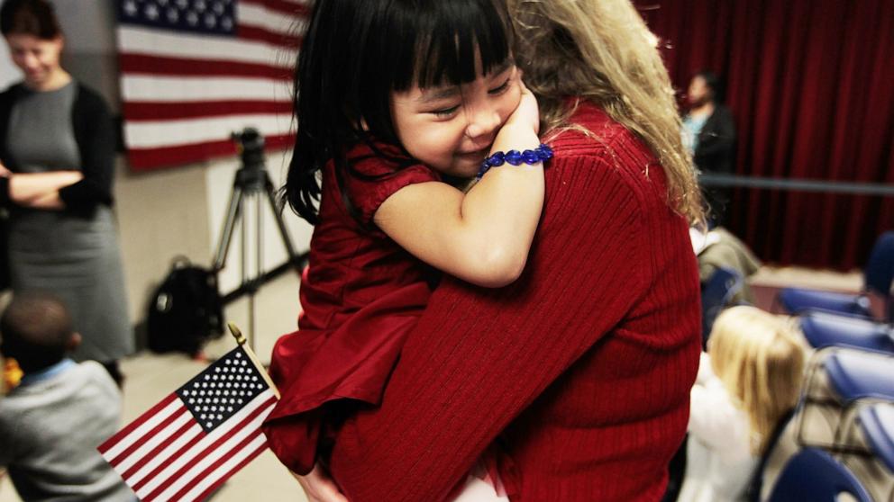 PHOTO: In this file photo, newly-naturalized Jillian, 4, originally from China, is held by her adoptive mother Eileen Kalerduring during a ceremony at the U.S. Citizenship and Immigration Services offices in New York City, Nov. 18, 2010.