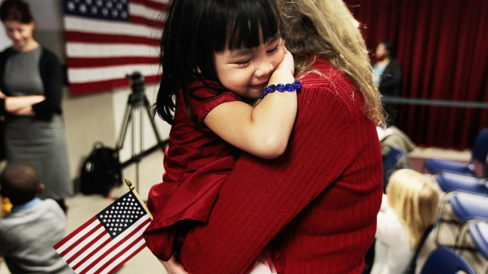 PHOTO: In this file photo, newly-naturalized Jillian, 4, originally from China, is held by her adoptive mother Eileen Kalerduring during a ceremony at the U.S. Citizenship and Immigration Services offices in New York City, Nov. 18, 2010.