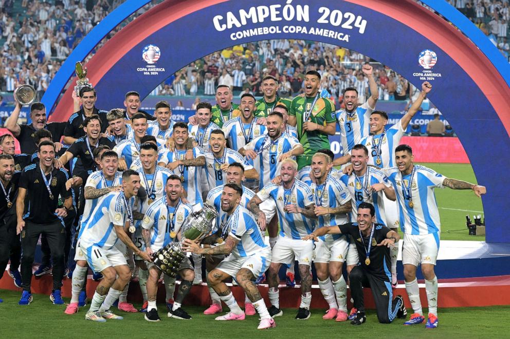 PHOTO: Argentina's forward #10 Lionel Messi lifts up the trophy as he celebrates winning the Conmebol 2024 Copa America tournament final football match between Argentina and Colombia in Miami, FL, July 14, 2024. 