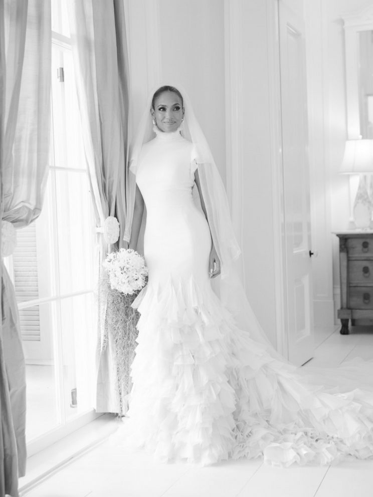 Jennifer Lopez poses for a photo in her wedding dress by Ralph Lauren.