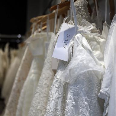PHOTO: Wedding dresses are displayed in a window at a David's Bridal store in Manhattan on November 19, 2018 in New York City.