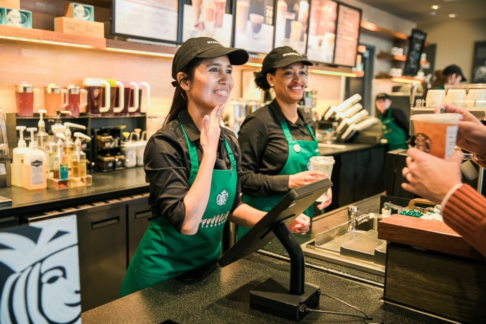 PHOTO: Partners take an order on Monday, October 22, 2018 at Starbucks first U.S. Signing Store in Washington D.C.