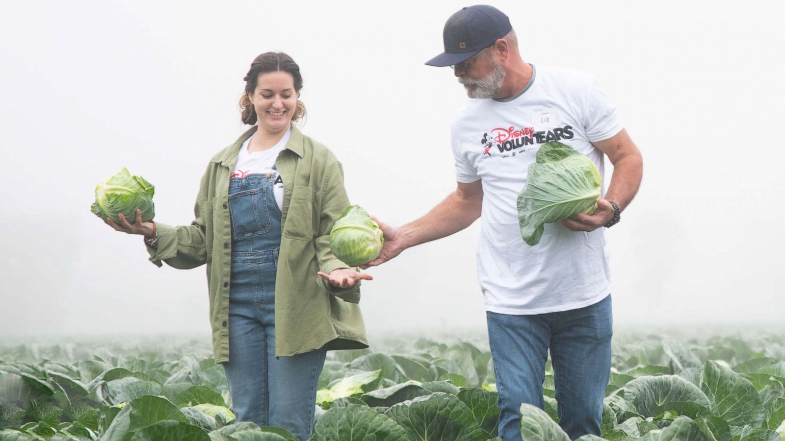 PHOTO: A Disney cast member voluntEAR with a farmer.