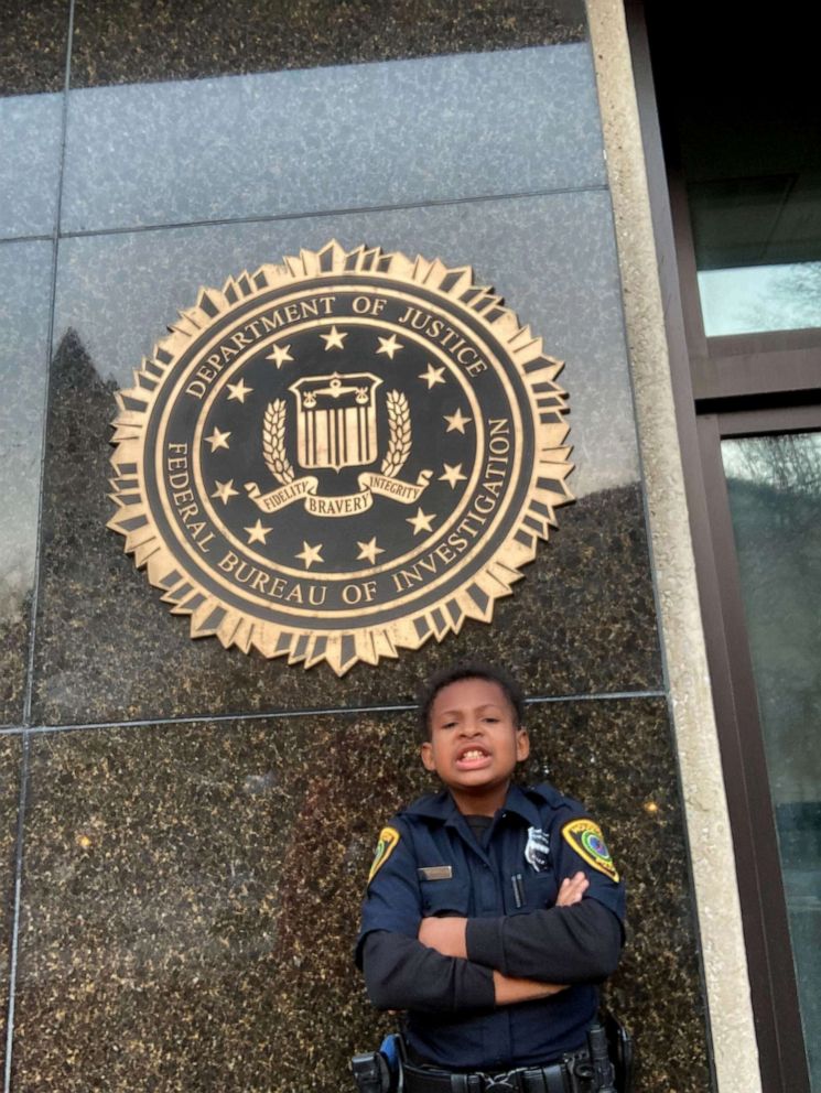 PHOTO: Devarjaye "DJ" Daniel poses for a photo ouside the J. Edgar Hoover building, the FBI's headquarters in Washington, D.C.