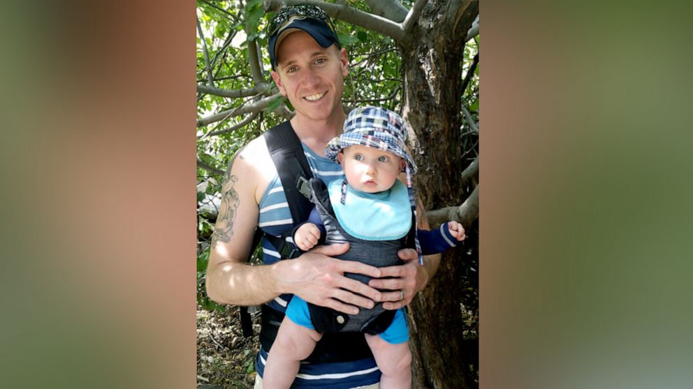 PHOTO: David Milender poses with his son George in this undated family photo.