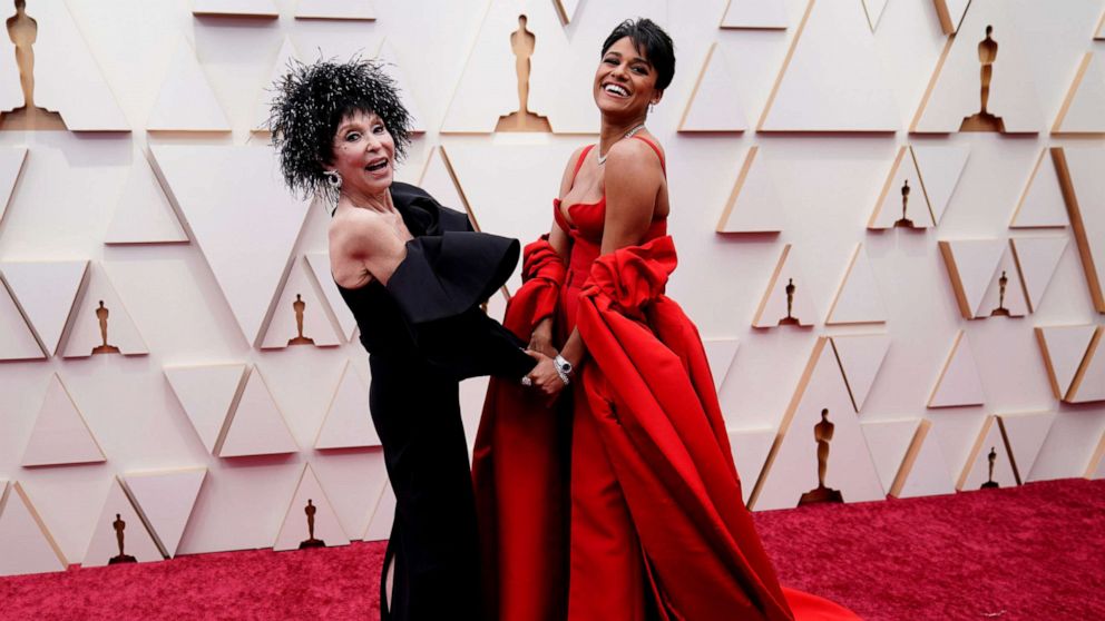 PHOTO: Rita Moreno, left, and Ariana DeBose arrive at the Oscars, March 27, 2022, at the Dolby Theatre in Los Angeles.