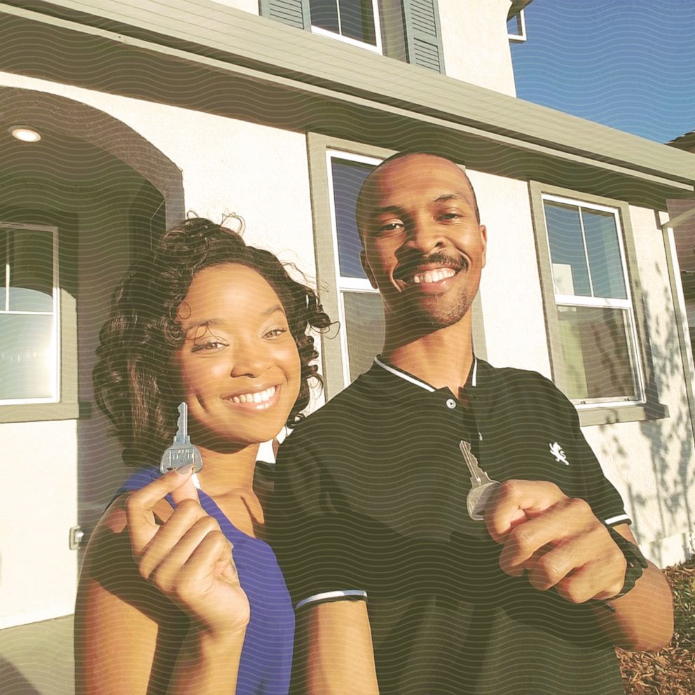 DJ and Dannie Vann hold the keys to their newly purchased home, which they bought in 2017.