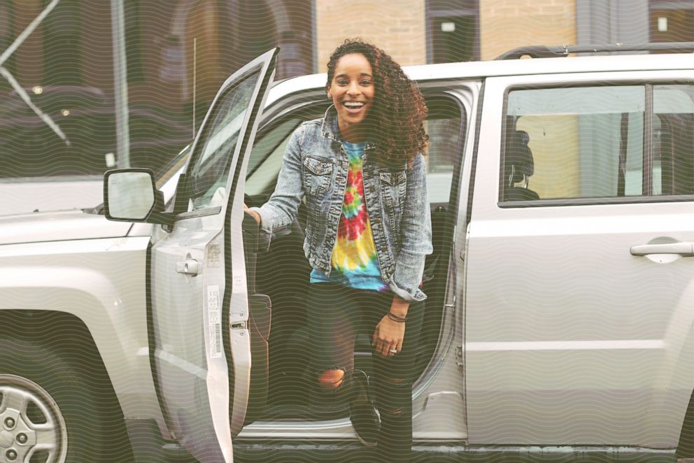 PHOTO: Carmen Perez, 35, poses for a photo with her car. 