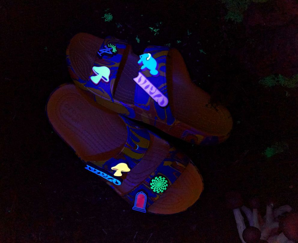 PHOTO: The Diplo X Crocs Classic Clog features a swirled pink, blue and yellow paint-inspired graphic loaded with light-up, three-dimensional out-of-this-world mushroom Jibbitz charms.