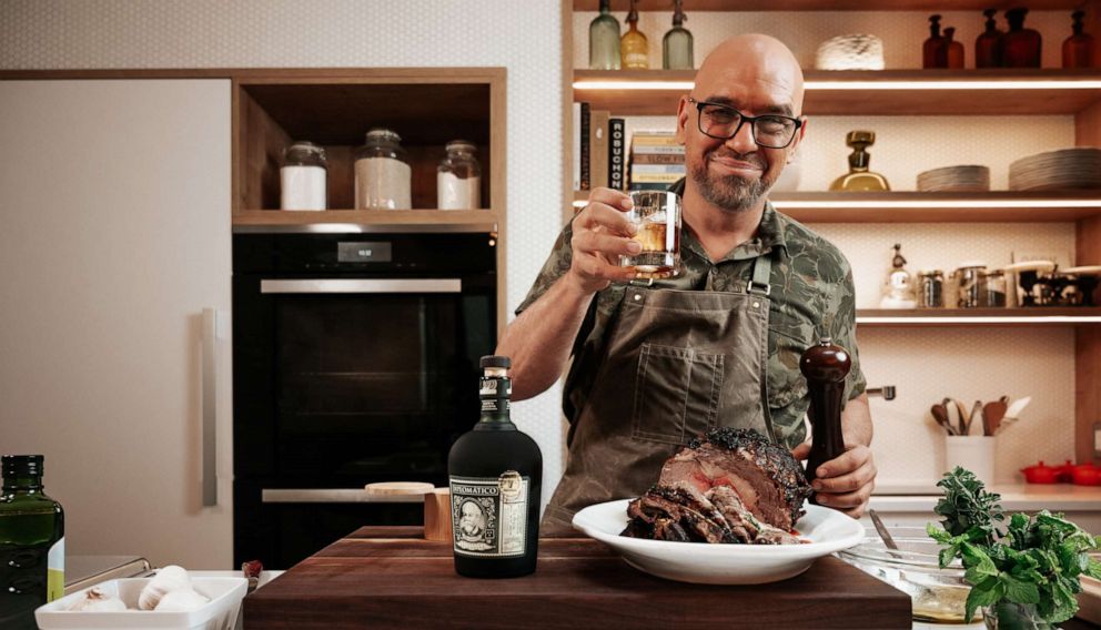 PHOTO: Chef Michael Symon raises a glass after announcing a new collaboration with Diplomatico Rum.