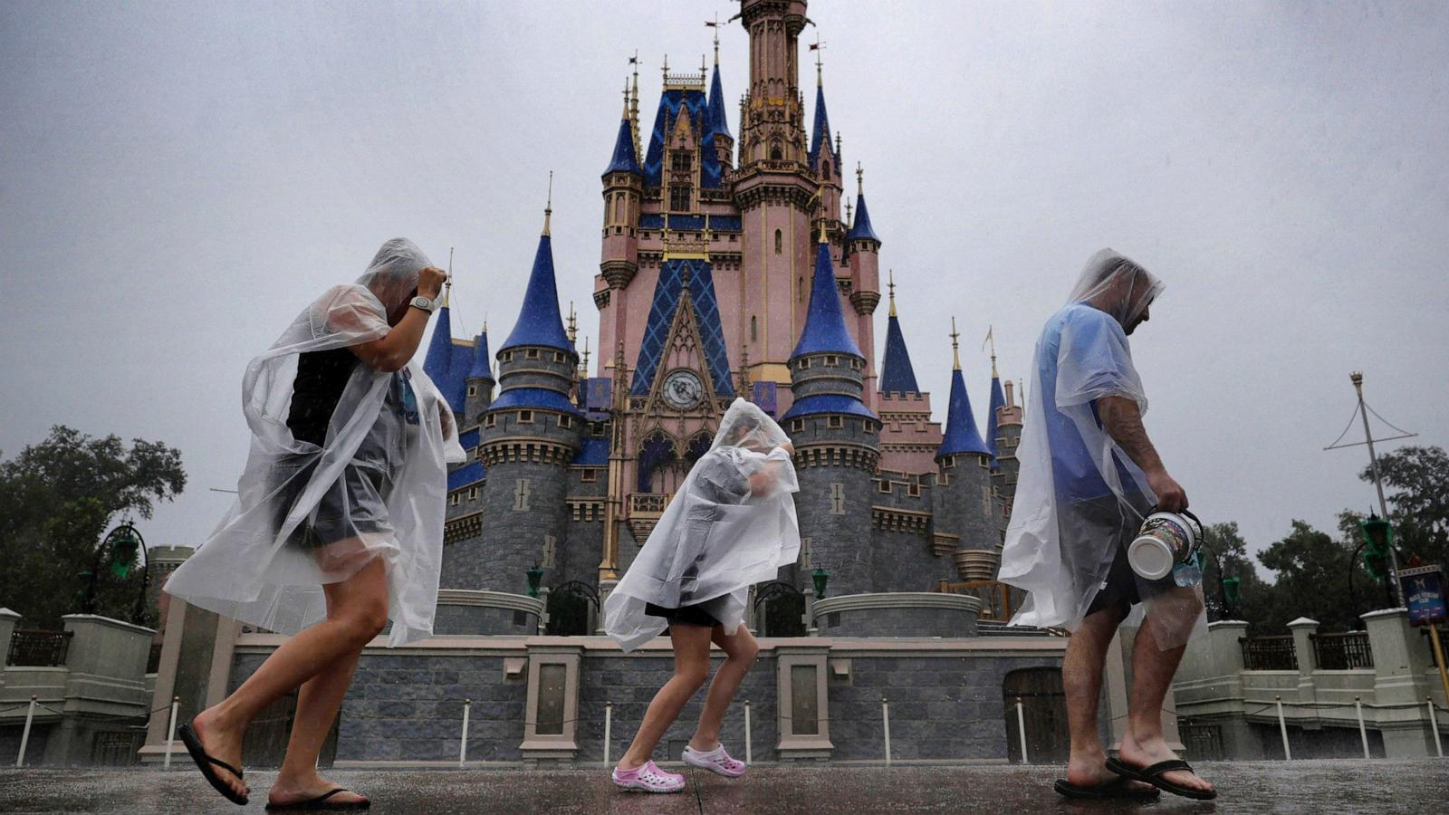 PHOTO: Guests weather early bands of rain from Hurricane Milton at the Magic Kingdom at Walt Disney World in Bay Lake, Fla., Oct. 9, 2024.