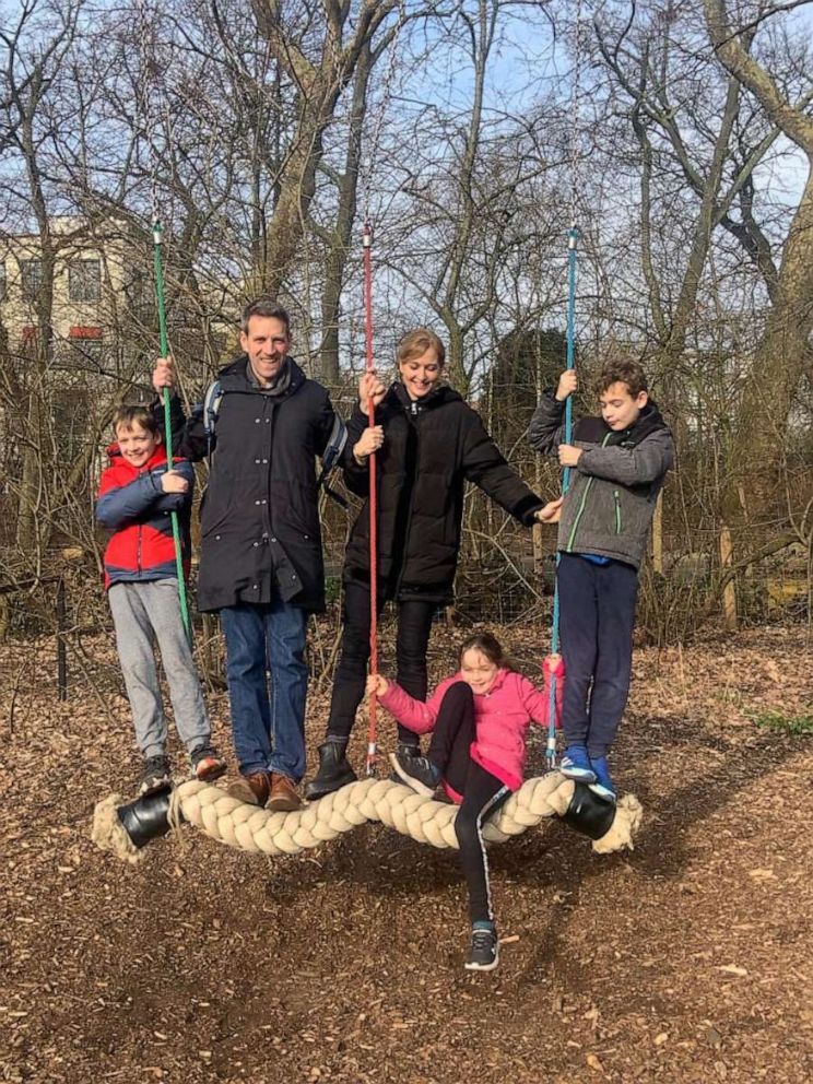 PHOTO: The Dixon family (L-R) Harry, Charlie, Mel, Rosie and Tom pose for a photograph on a swing.