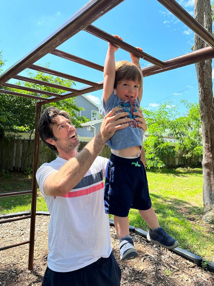 PHOTO: Dominic McNulty lifts up his son, Dominic Jr.