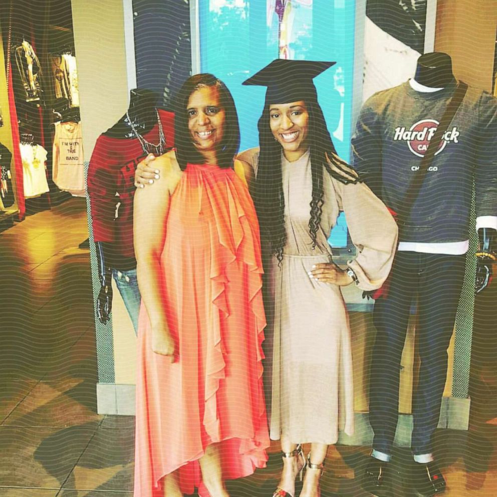 PHOTO: Dominique poses for a photo with her mom on graduation day from Columbia college
