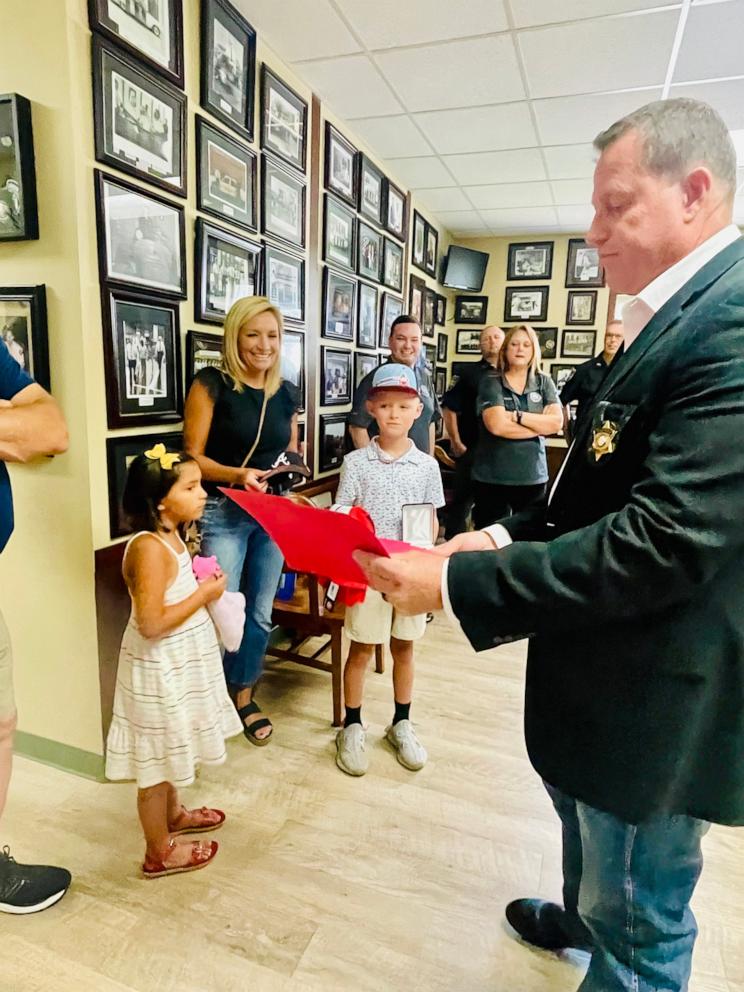 PHOTO: Gordon County Sheriff Mitch Ralston presented Drake with a citizen service award and a medal.