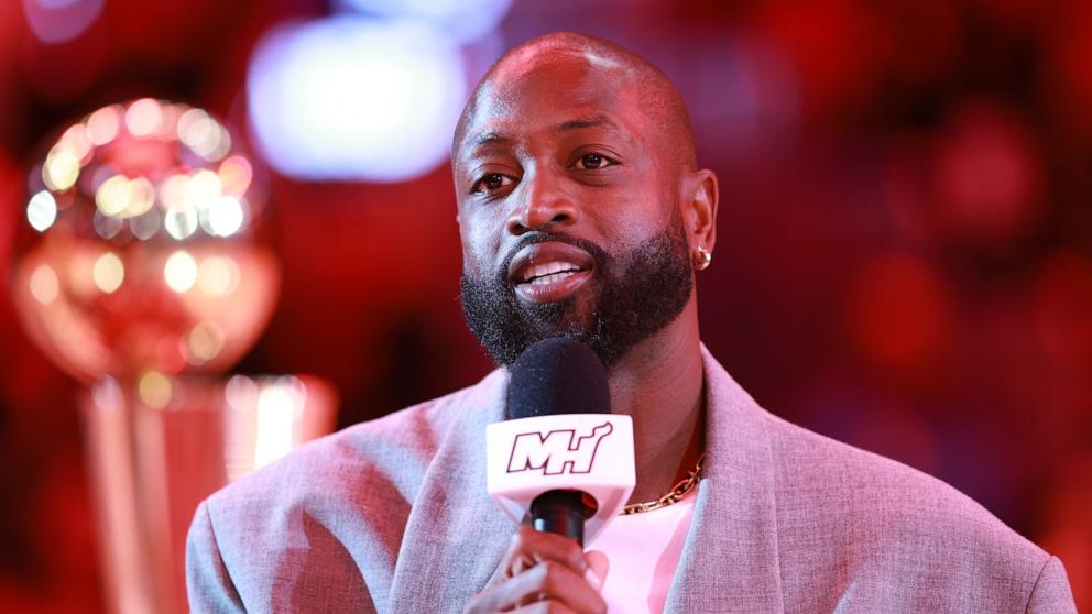 PHOTO: Dwyane Wade is honored following his statue unveiling on October 27th, with a ceremony during a game between the Miami Heat and the Detroit Pistons at Kaseya Center on Oct. 28, 2024 in Miami.