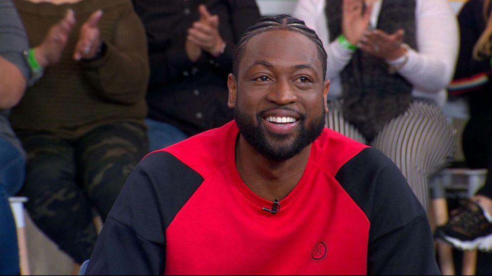 Dwyane Wade, Gabrielle Union, and Kaavia at Miami Heat Game