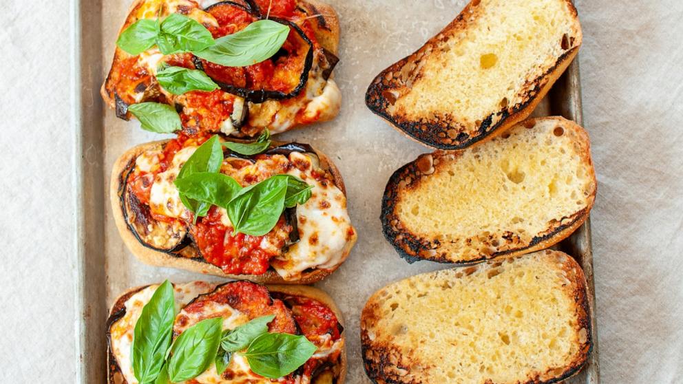 PHOTO: A sheet tray of eggplant parm sandwiches.