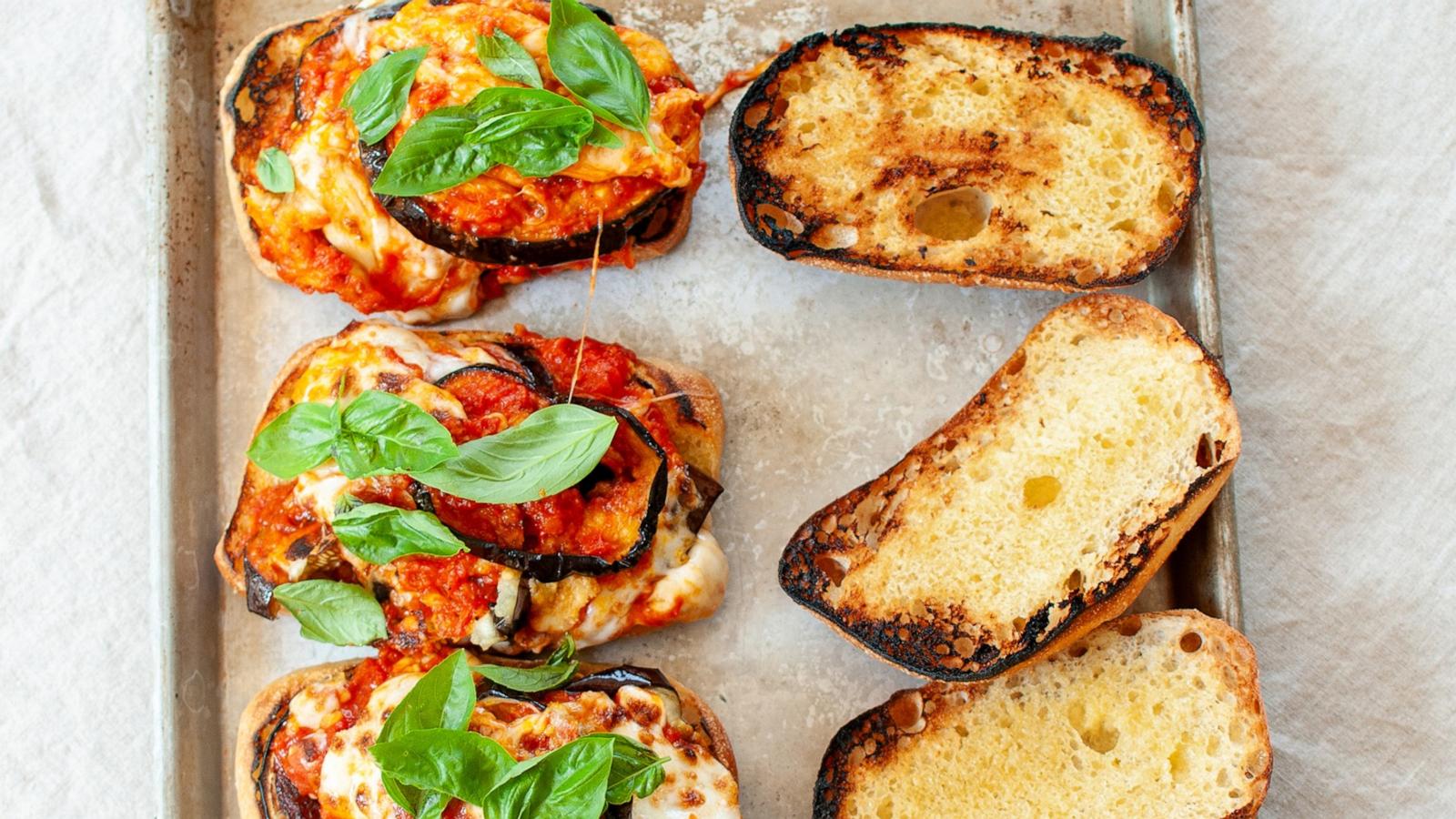 PHOTO: A sheet tray of eggplant parm sandwiches.