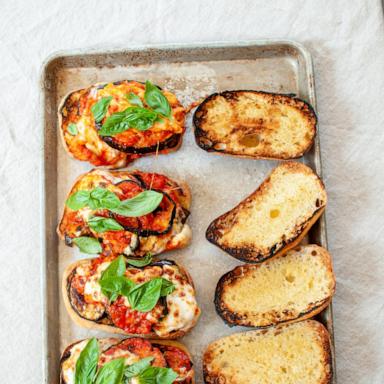 PHOTO: A sheet tray of eggplant parm sandwiches.