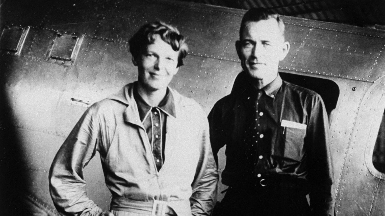 PHOTO: Famed aviatrix Amelia Earhart and her navigator, Fred Noonan, pose in front of their twin-engine Lockheed Electra in Los Angeles at the end of May, 1937, prior to their flight around the world.