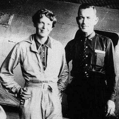 PHOTO: Famed aviatrix Amelia Earhart and her navigator, Fred Noonan, pose in front of their twin-engine Lockheed Electra in Los Angeles at the end of May, 1937, prior to their flight around the world.