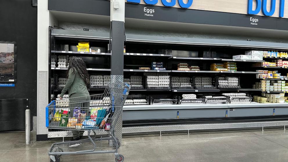 PHOTO: A shopper selects a carton of eggs from a display in a Walmart store, Feb. 7, 2025, in Englewood, Colo.