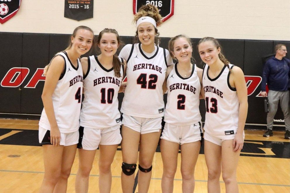 PHOTO: Rocky poses for a photo alongside her senior teammates on the Heritage High School girls varsity basketball team.