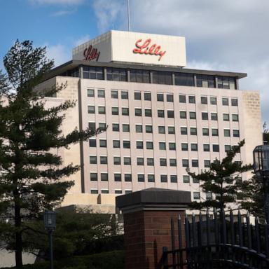 PHOTO: The company logo sits atop a building on the headquarters campus of Eli Lilly and Company, March 17, 2024 in Indianapolis, Indiana.