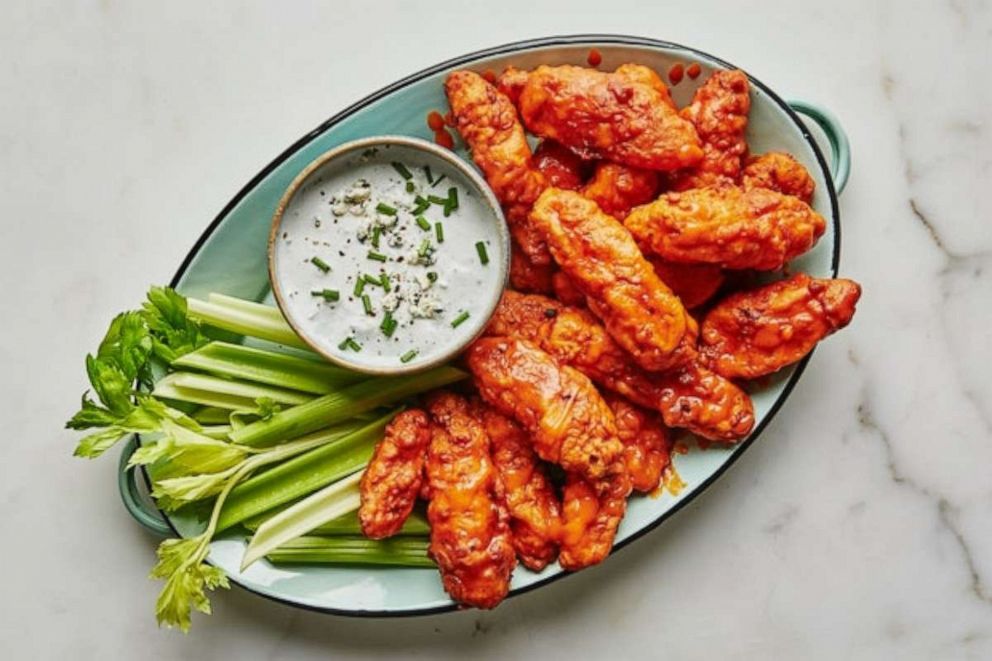 PHOTO: A plate of "boneless wings" coated in buffalo sauce.