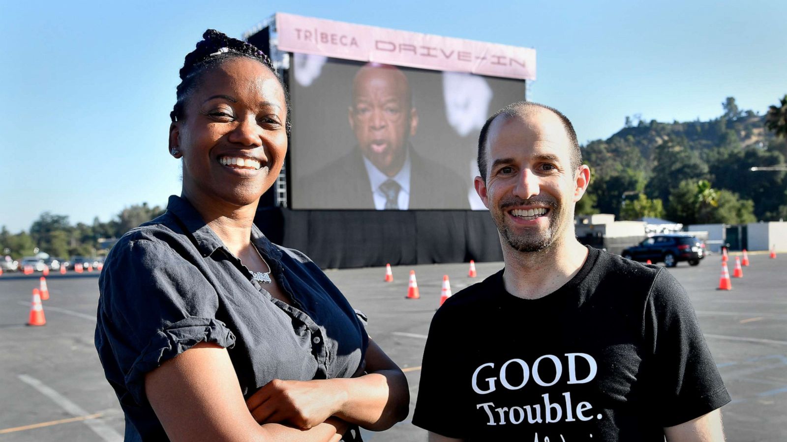 PHOTO: Erika Alexander and Ben Arnon, producers of "John Lewis: Good Trouble" pose for a photo at the Tribeca Drive-In screening at the Rose Bowl on July 2, 2020 in Pasadena, Calif.