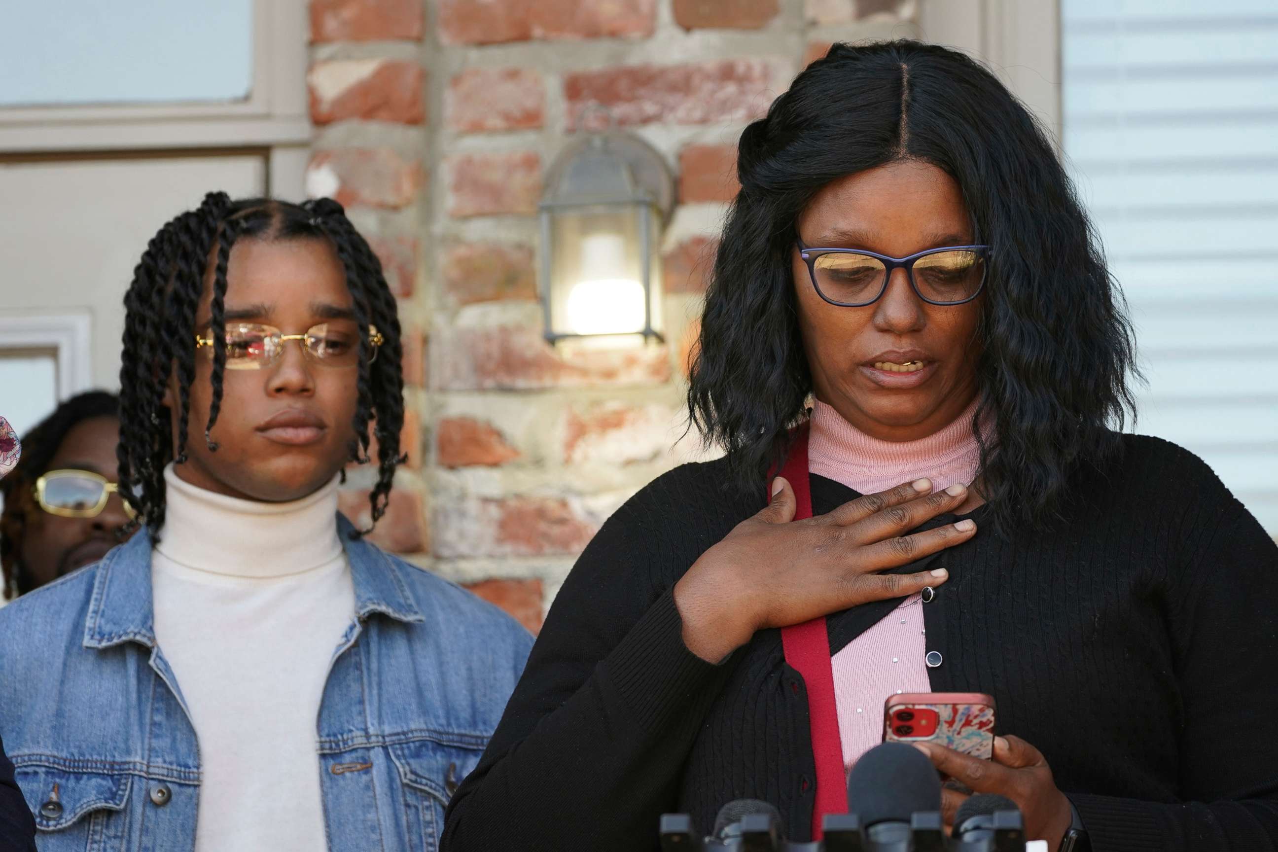 PHOTO: FedEx driver D'Monterrio Gibson, left, listens to his mother, Sharon McClendon speak about her reaction upon hearing about the alleged assault on her son during a news conference in Ridgeland, Miss., Feb. 10, 2022. 