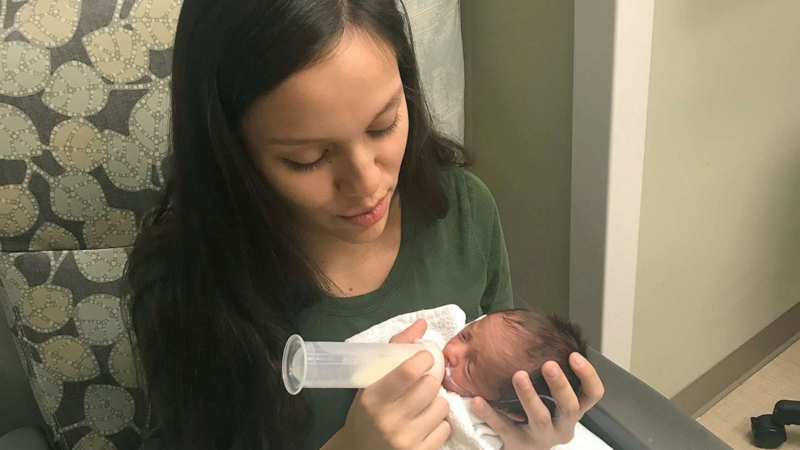 PHOTO: Odalis Contreras, then 15, feeding her son Angel in the hospital after he was born.