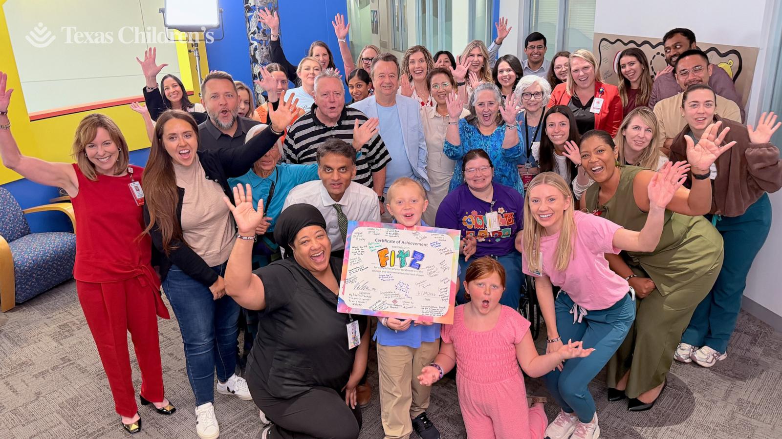 PHOTO: Fitz, 10, rang the bell signifying the end of his treatment on June 24, 2026, after about eight months of chemotherapy, surgery and treatment for a rare liver cancer.