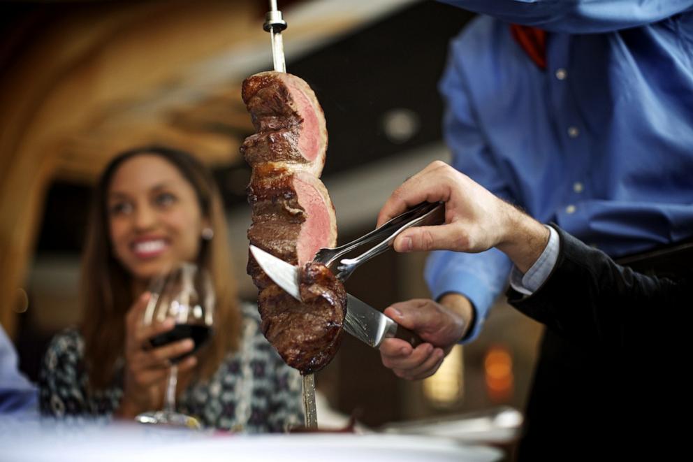 PHOTO: Fogo’s signature Full Churrasco Experience, featuring grilled meats carved tableside by skilled Gaucho chefs.