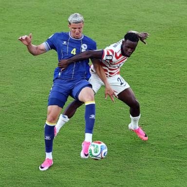 PHOTO: Folarin Balogun of the U.S. fouls Bosnia and Herzegovina's Tarik Muharemovic before being shown a red card during their FIFA World Cup 2026 Round of 32 match July 1, 2026 in Santa Clara, Calif.