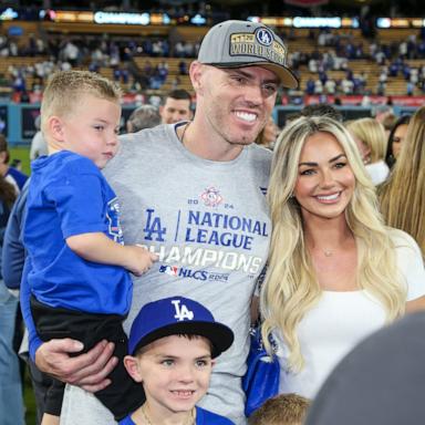 PHOTO: Freddie Freeman of the Los Angeles Dodgers poses for a photo with his family after defeating the New York Mets in Game 6 of the NLCS presented by loanDepot at Dodger Stadium in Los Angeles, Oct. 20, 2024.