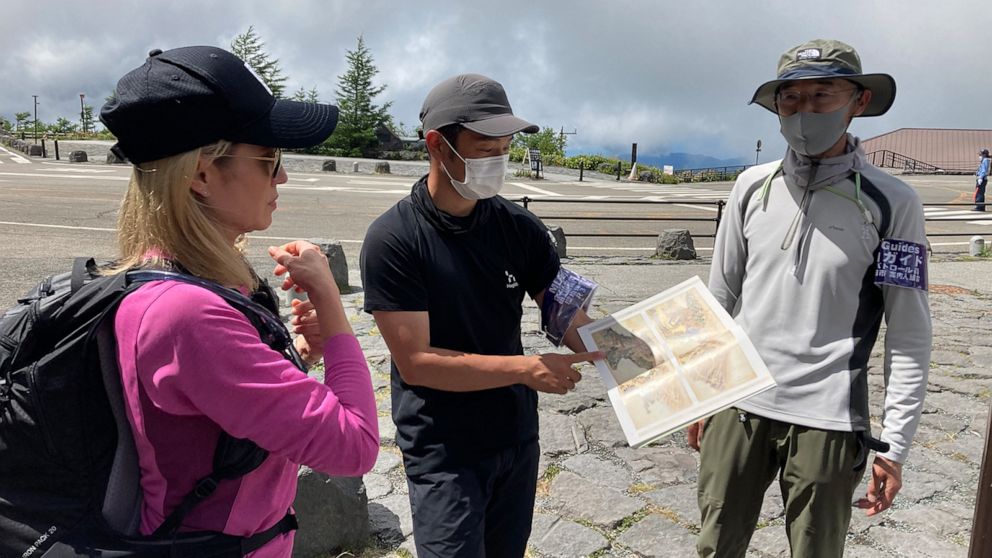 PHOTO: Representative director of the Mount Fuji Trail Club, Yasuhiko Ota holds map.